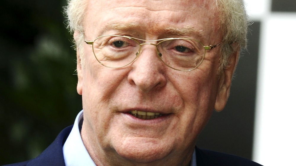 Michael Caine smirking