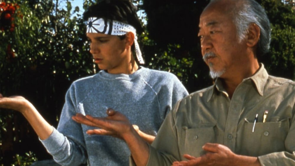 Pat Morita as Mr. Miyagi and Ralph Macchio as Daniel LaRusso in The Karate Kid