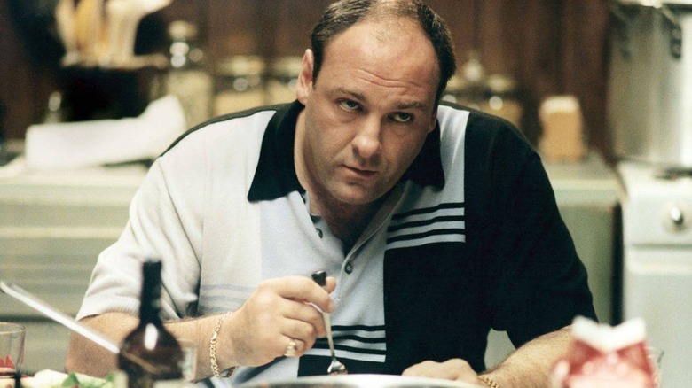 Tony Soprano eating at a table