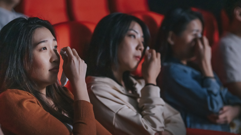 Women crying in movie theater