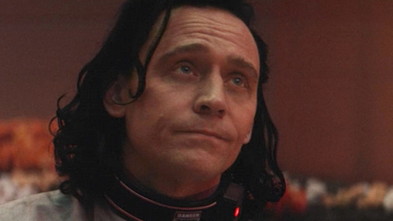 Loki looking up at Sif