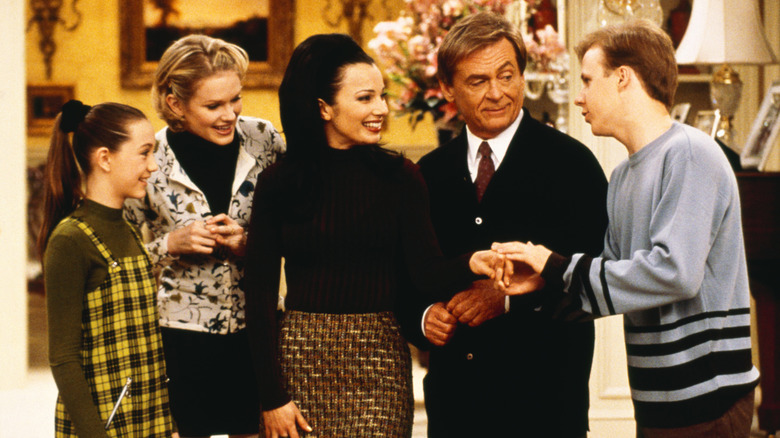 Fran Fine, Niles, Margaret, Brighton, and Grace standing together in The Nanny