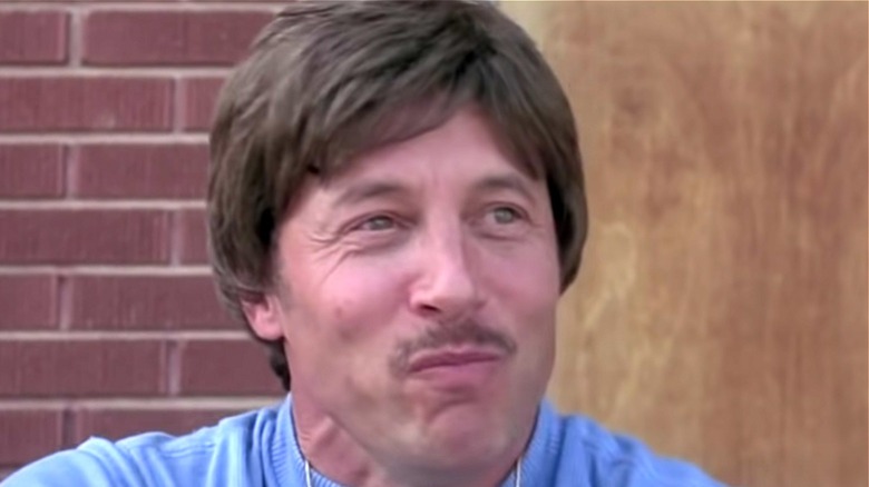 Uncle Rico smirking