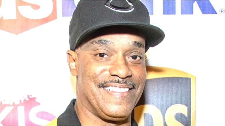 Rocky Carroll wearing a hat