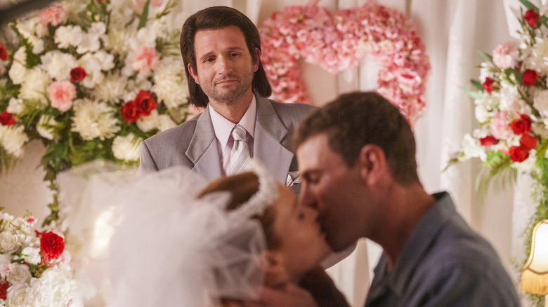 The preacher watches Gibbs and Diane kiss in 