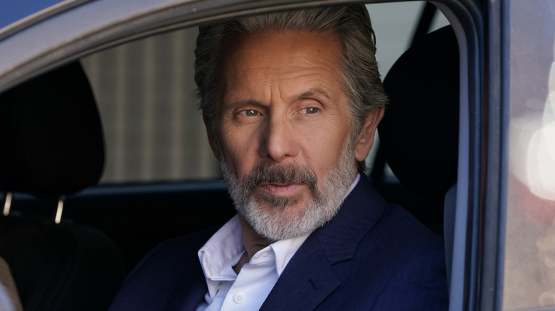 Alden Parker stares out a car window in 