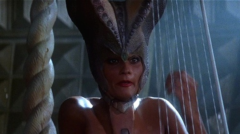 Instrument Spinster plays harp