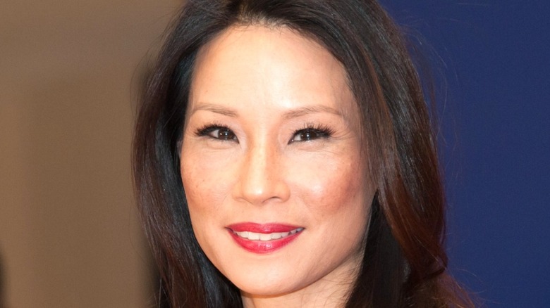 Lucy Liu smiling on red carpet