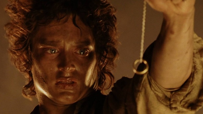 Frodo holds up the One Ring in The Return of the King