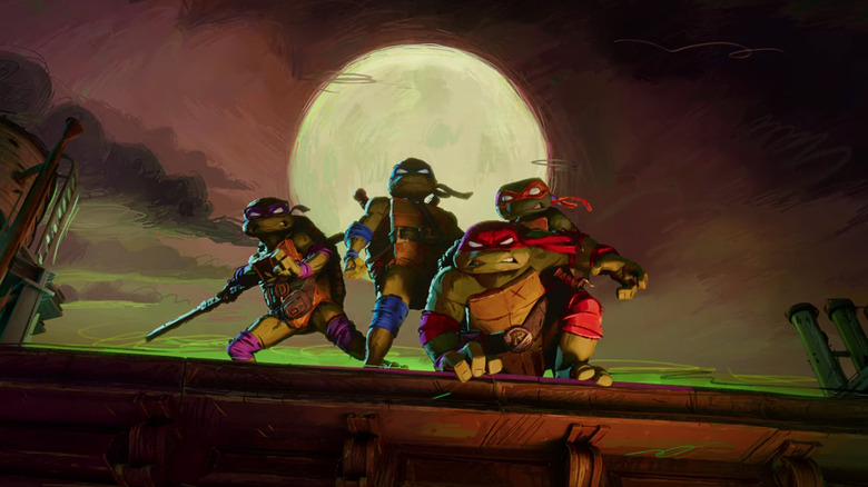 The four turtles posing on a rooftop together