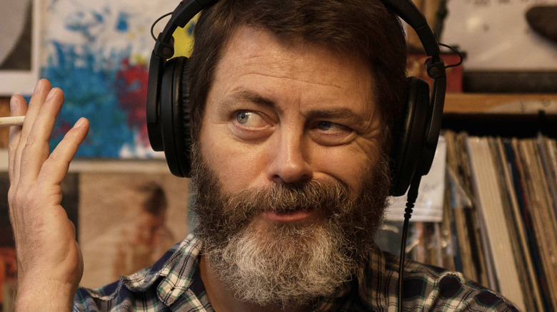 Nick Offerman wearing headphones