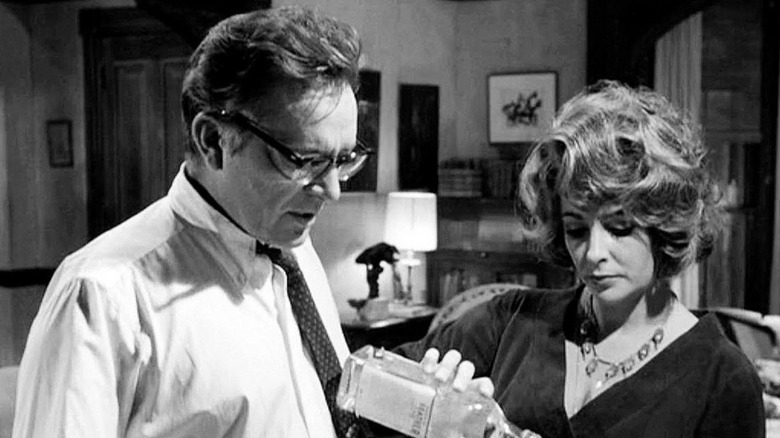 George watching Martha pour a drink in Who's Afraid of Virginia Woolf