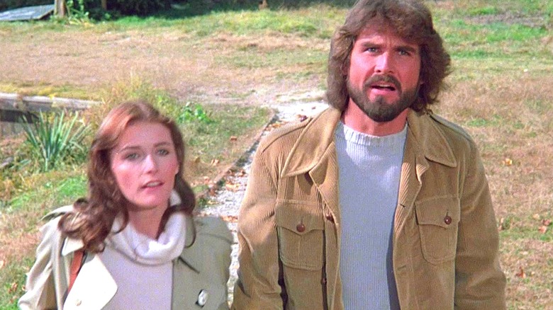 George and Kathy Lutz looking up in The Amityville Horror (1979)