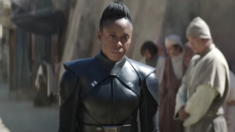 Reva standing in Tatooine village