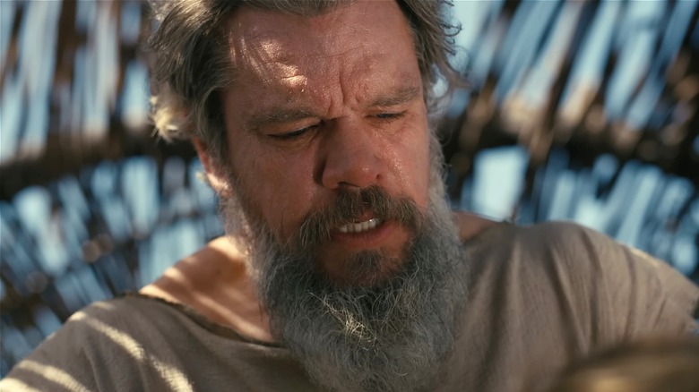 Odysseus looking down in Calypso's hut in The Odyssey (2026)