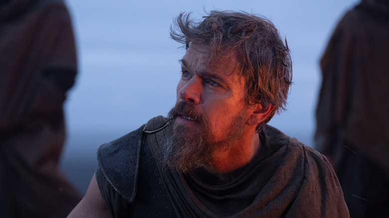 Odysseus looking up in shock in The Odyssey (2026)