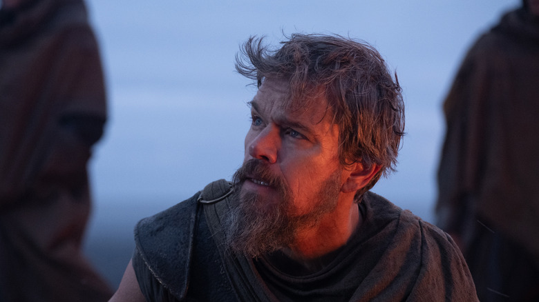 Odysseus looking up in shock in The Odyssey (2026)