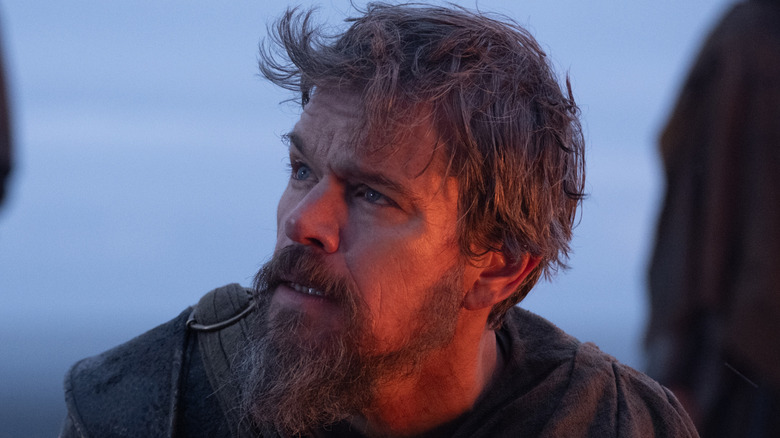Odysseus looking up in shock in The Odyssey (2026)