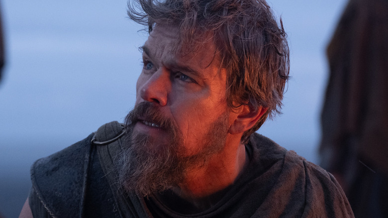 Odysseus looking up in shock in The Odyssey (2026)
