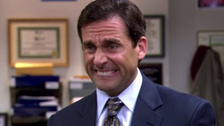 Michael Scott biting his lip.