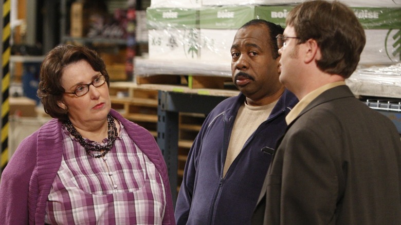 Phyllis, Stanley, and Dwight talking