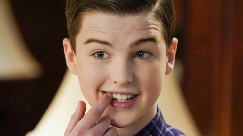Young Sheldon point to tooth