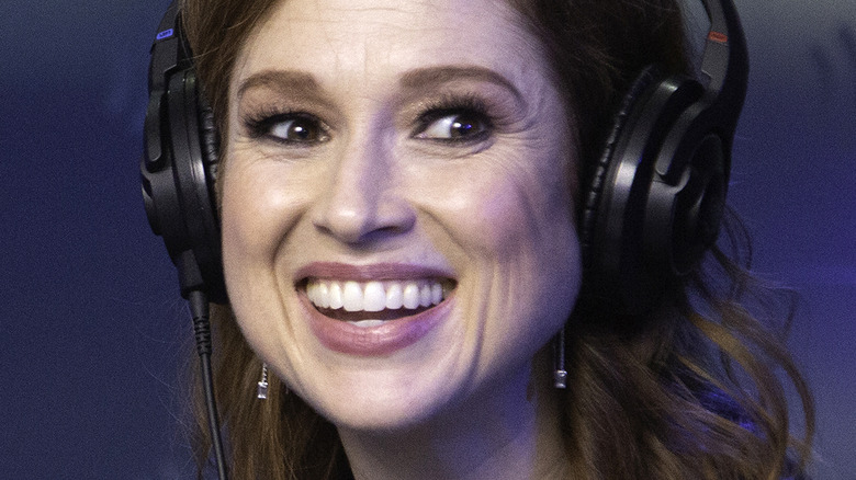 Ellie Kemper smiling with headphones on