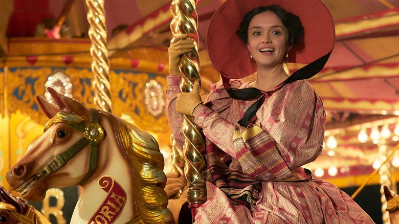 Becky riding on a carousel
