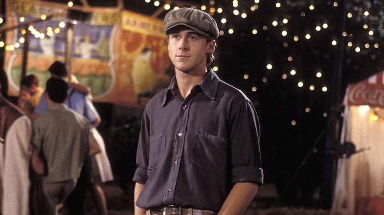 Ryan Gosling as Noah wearing hat