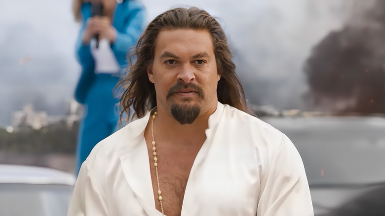 Dante Reyes wearing white shirt and long necklace