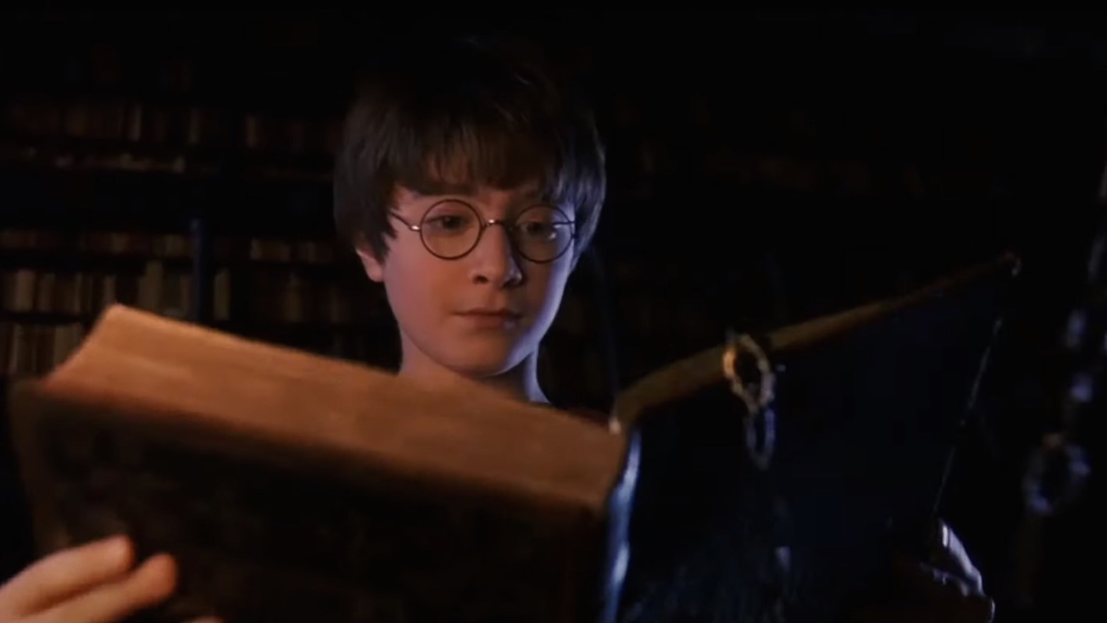 Columbus, Chris. Harry Potter And The Sorcerers Stone. 2001. Harry reading from a book in the restricted section.