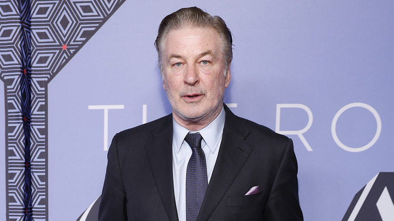 Alec Baldwin looks on