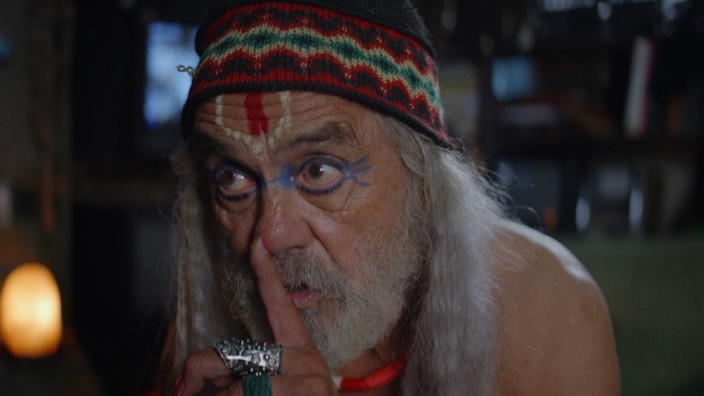 Tommy Chong as Ezra shushing