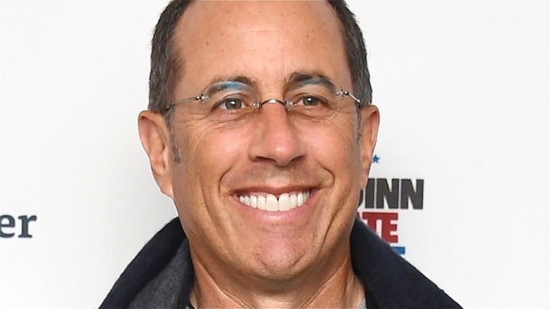 Jerry Seinfeld smiling with glasses