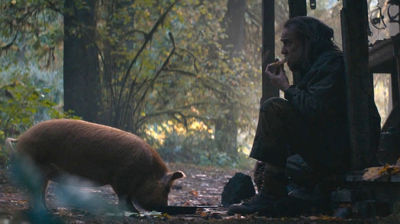 Rob in woods eating w/pig