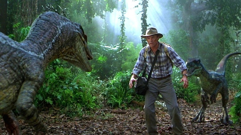 Alan Grant looking at a dinosaur