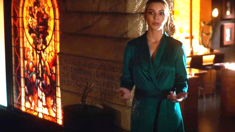 Chloe Decker standing next to Lucifer's tusk relic