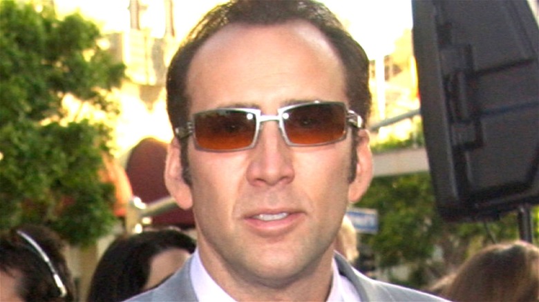 Nicolas Cage smiling red sunglasses