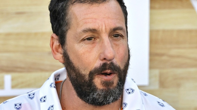 Adam Sandler wearing white shirt