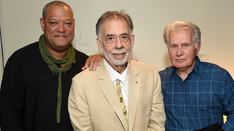 Laurence Fishburne, Francis Ford Coppola, and Martin Sheen posing at the 