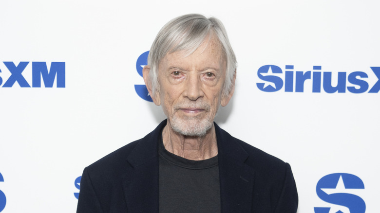 Scott Glenn in front of a step and repeat