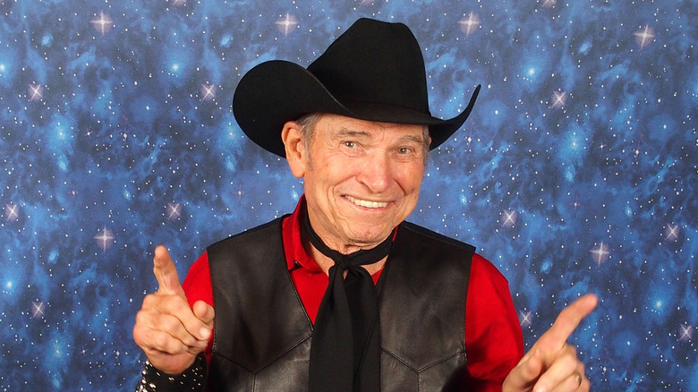 Burton smiling in cowboy hat