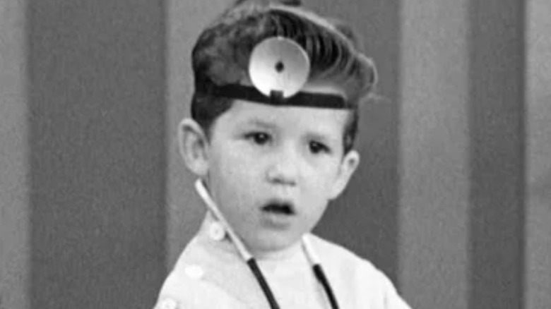 Little Ricky in doctor's outfit