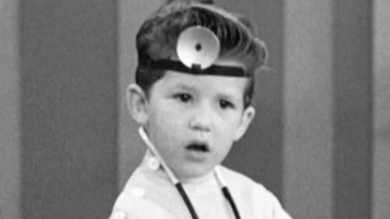 Little Ricky in doctor's outfit