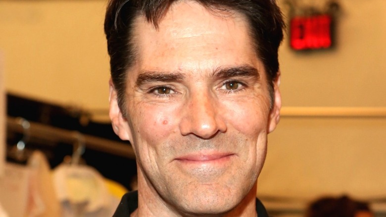 Thomas Gibson smiling into camera