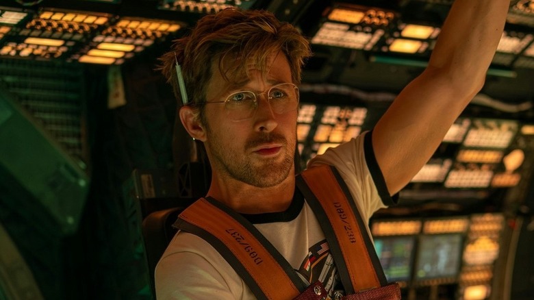 Ryland Grace wearing glasses and piloting the ship in 