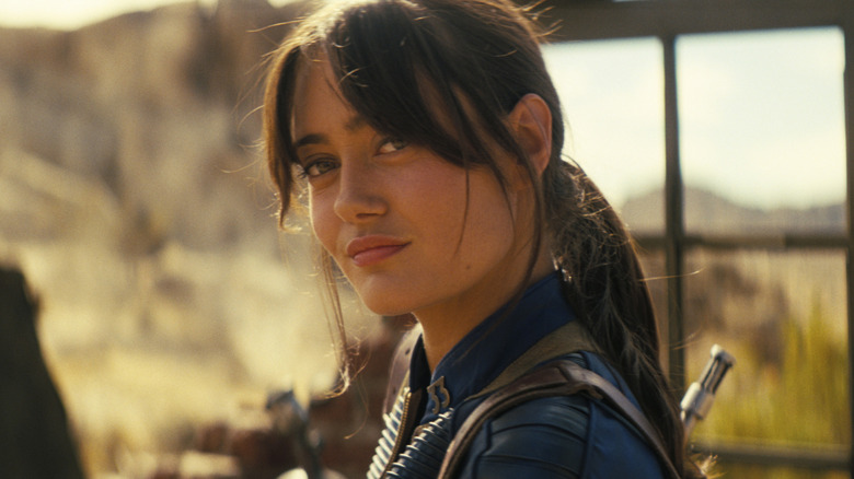 Lucy smirking in the wasteland in "Fallout" (2024-present)