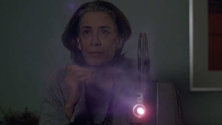 Eunice watching an old home movie in I'm Still Here (2024)