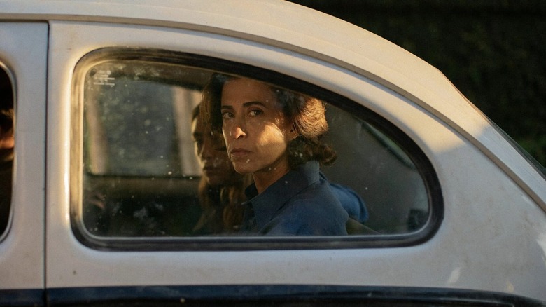 Eunice, looking mournful in a car in I'm Still Here (2024)