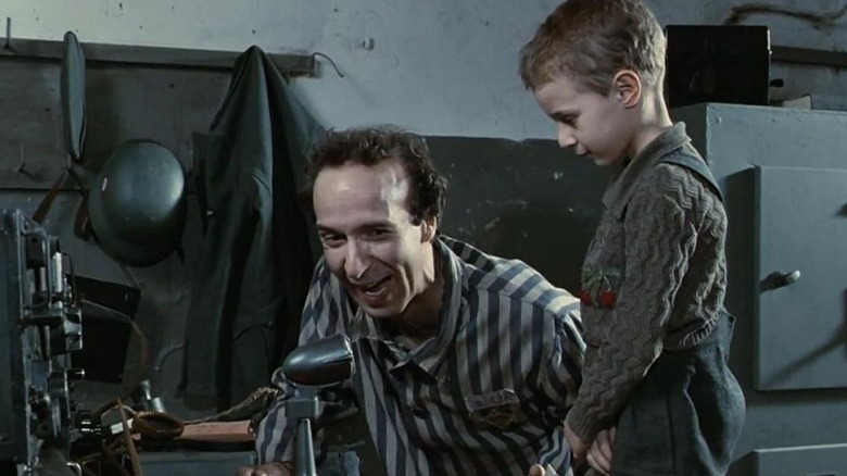 Guido Orefice entertaining his son in dire conditions in Life is Beautiful (1997)